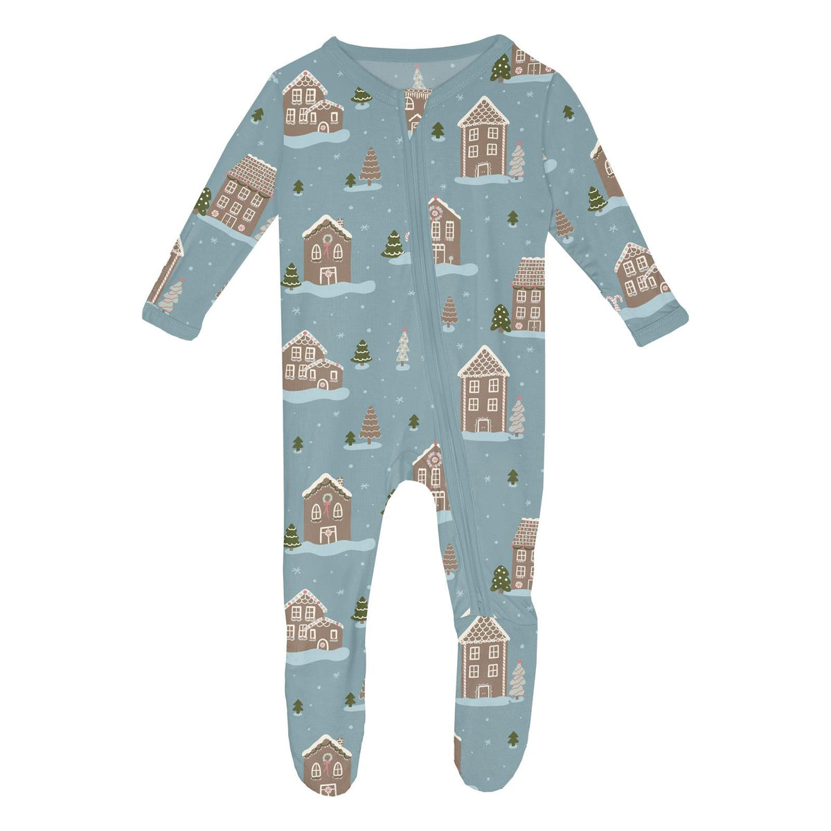 A baby long-sleeve footed sleeper with a light blue winter village print featuring gingerbread houses, Christmas trees, and snow, shown on a plain white background.