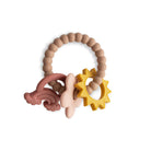 Teething ring with star and curved designs in pink, beige, and yellow on a white background