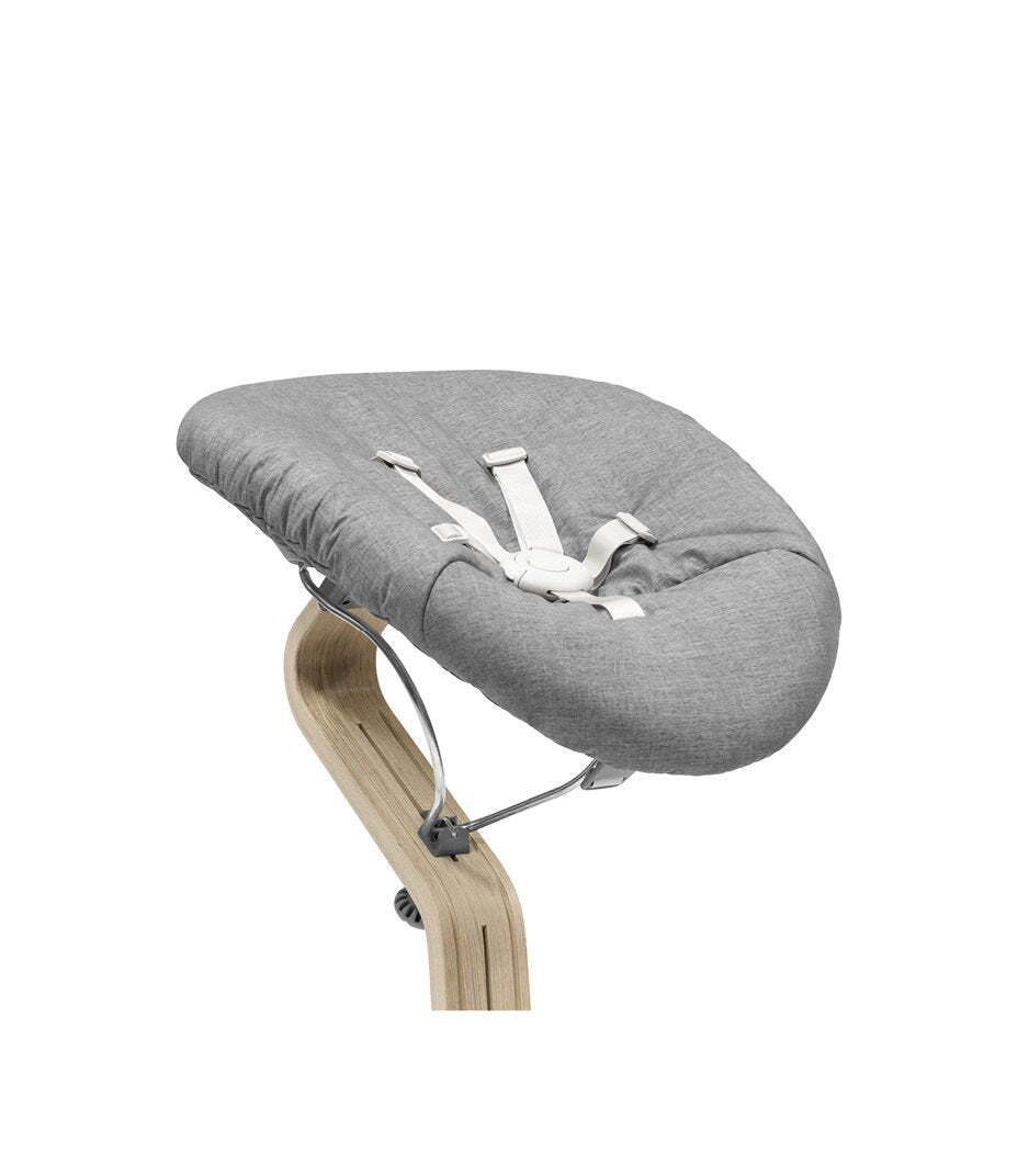 Gray baby bouncer with wooden base on a white background