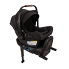 A profile view of a black MIXX Next + Pipa Aire RX Travel System by Nuna infant car seat attached to its base with a load leg, featuring an extended canopy, set against a checkered transparent background.