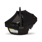 A profile view of a black MIXX Next + Pipa Aire RX Travel System by Nuna infant car seat featuring an exposed aerospace aluminum handle and an extended canopy with a mesh window, set against a checkered transparent background.