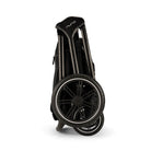 Black folding cart with 'Nuna' branding on a white background