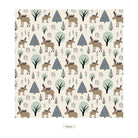 A repeating forest pattern featuring illustrated moose, deer, and stylized trees in muted beige, brown, sage green, and slate blue on a warm off-white background. The word 'Nordic' appears below the pattern as a color/style label.