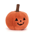 Plush pumpkin toy with a smiling face on a white background