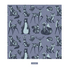 A repeating illustrated pattern of woodland animals and birds on a muted lavender-gray background, with a small label reading 'Moonlight' below the square artwork.