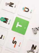 Educational card game with alphabet cards and animal illustrations on a white background