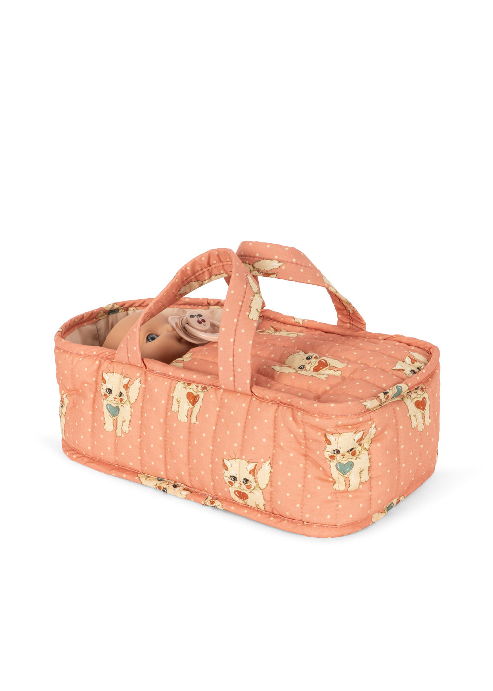 A quilted baby carrier bag in a peachy pink fabric with a repeating print of cartoon kittens, shown on a plain white background.