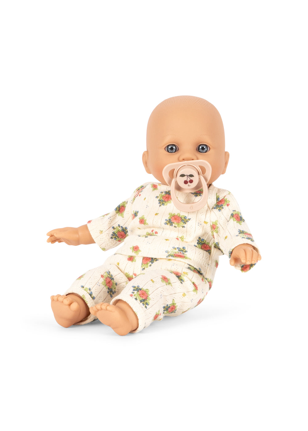 Baby doll wearing a floral outfit on a white background