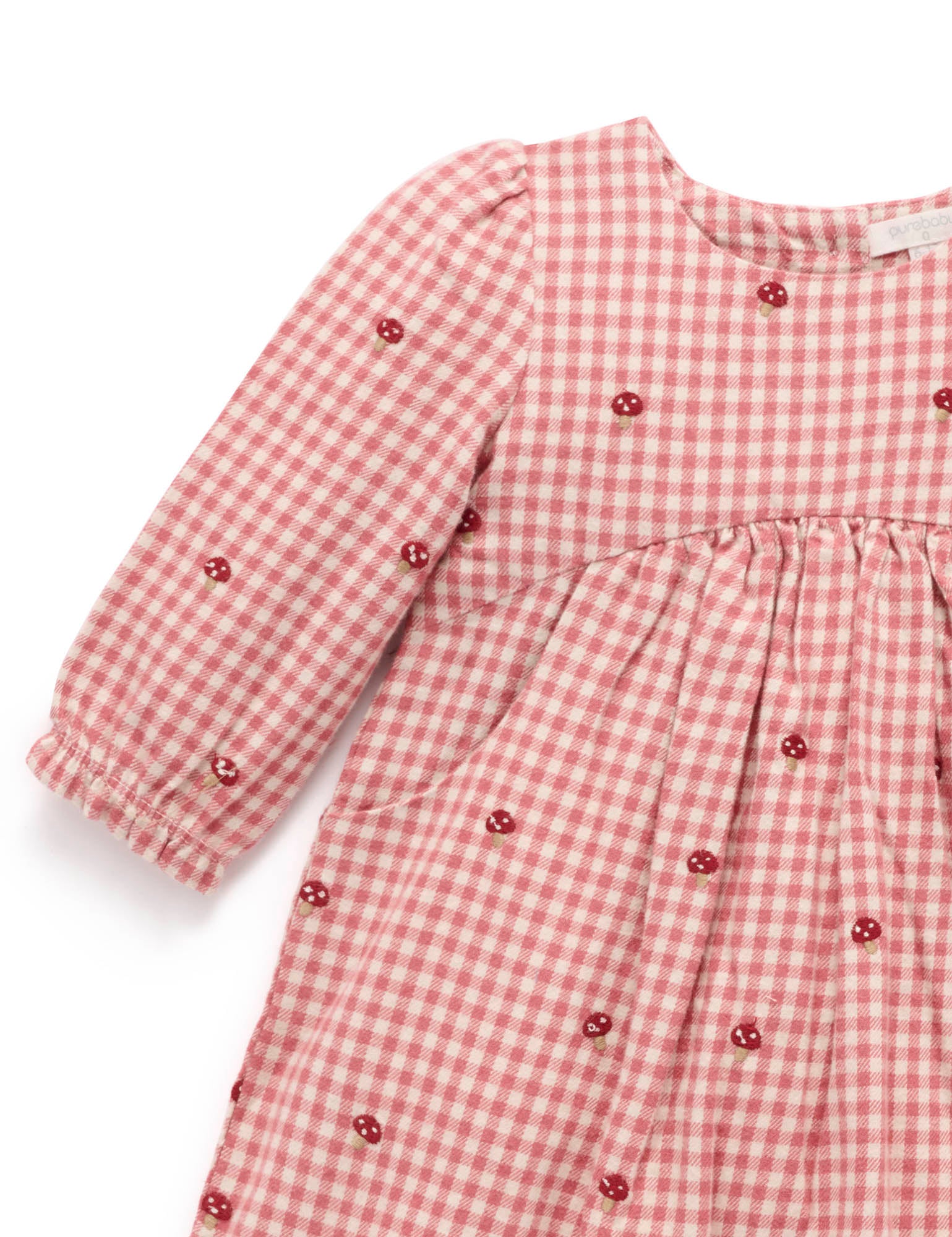 Red and white checkered dress with buttons on a white background