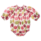 A baby long-sleeve romper with a smocked chest and puff sleeves, featuring an all-over print of stylized pumpkins in pink, red, green, and yellow on a cream background.