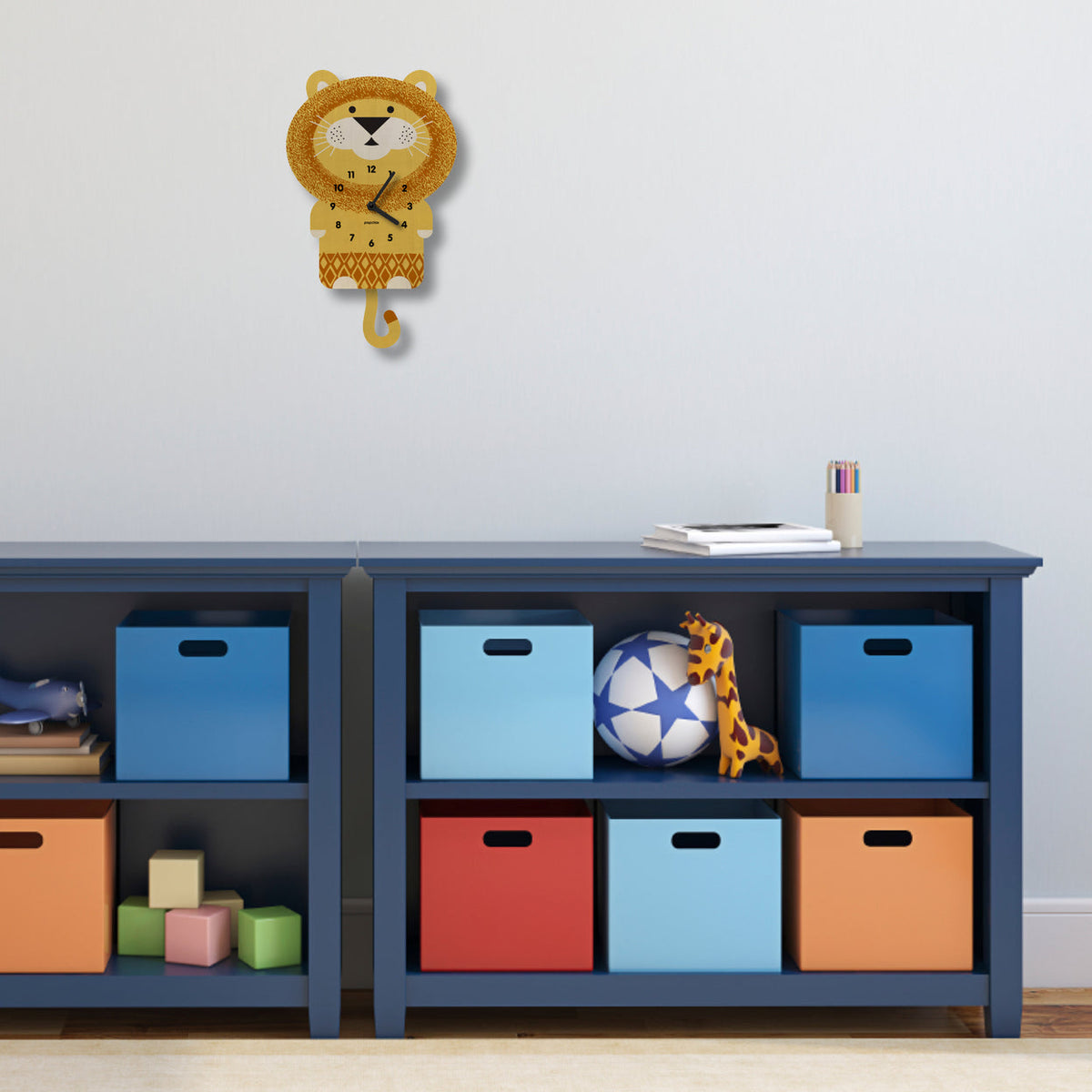 Children's storage unit with colorful bins and toys against a light blue wall.