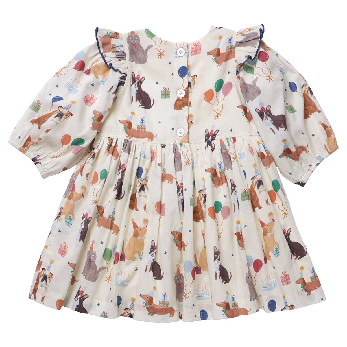 A baby girl's long-sleeve dress with a cream-colored base and an all-over print of dachshunds, balloons, and birthday candles. The dress features ruffled shoulders and a gathered skirt