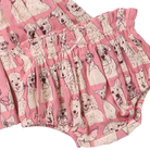 Pink ruffled bloomers with an all-over print of cartoon dog faces, shown alongside a matching top in the same fabric.