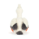 White plush toy with black spots on a white background