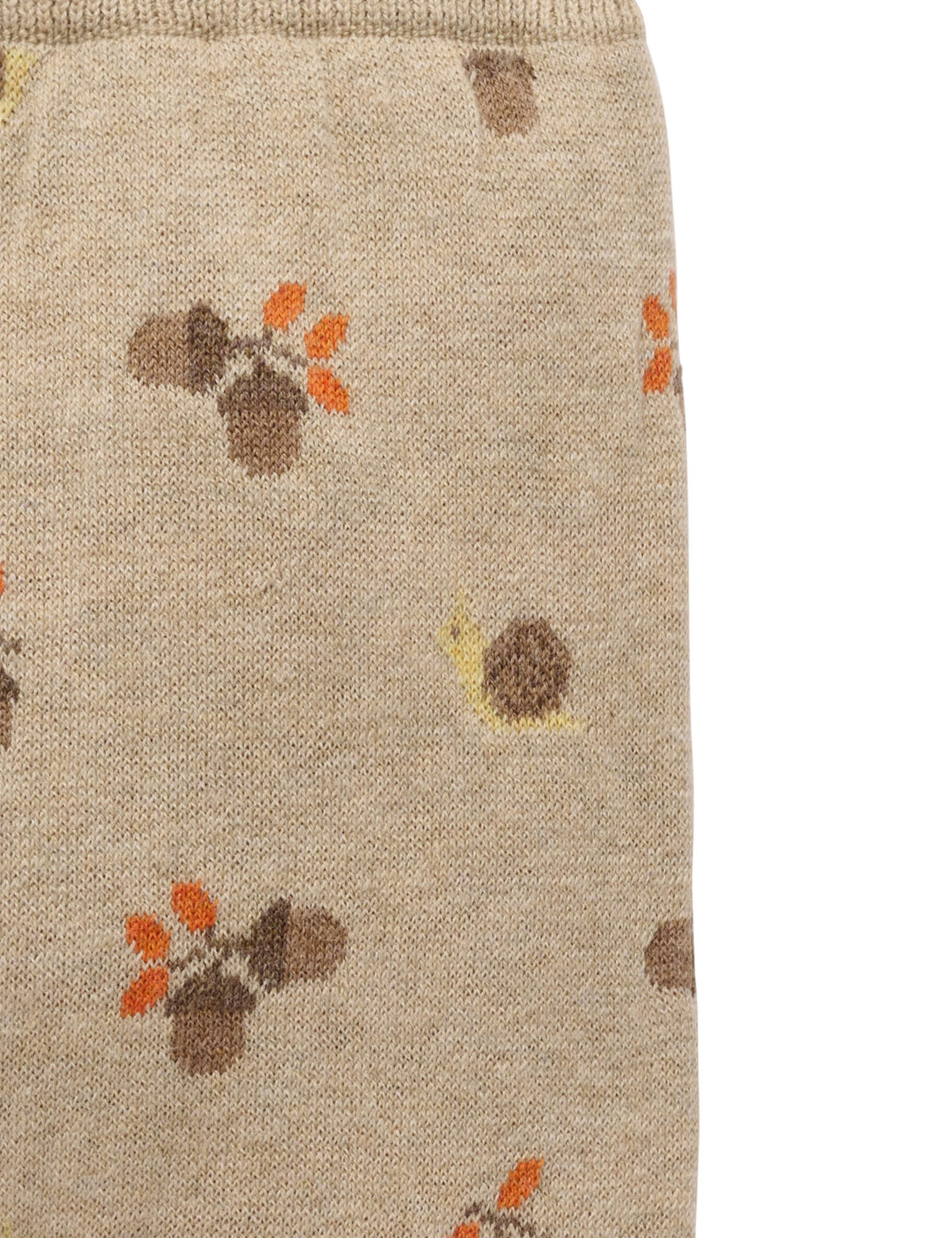 Beige fabric with acorn pattern on a beige background