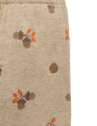 Beige fabric with acorn pattern on a beige background