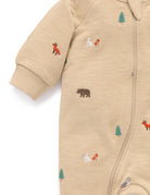 Beige baby snowsuit with forest animal embroidery on a white background