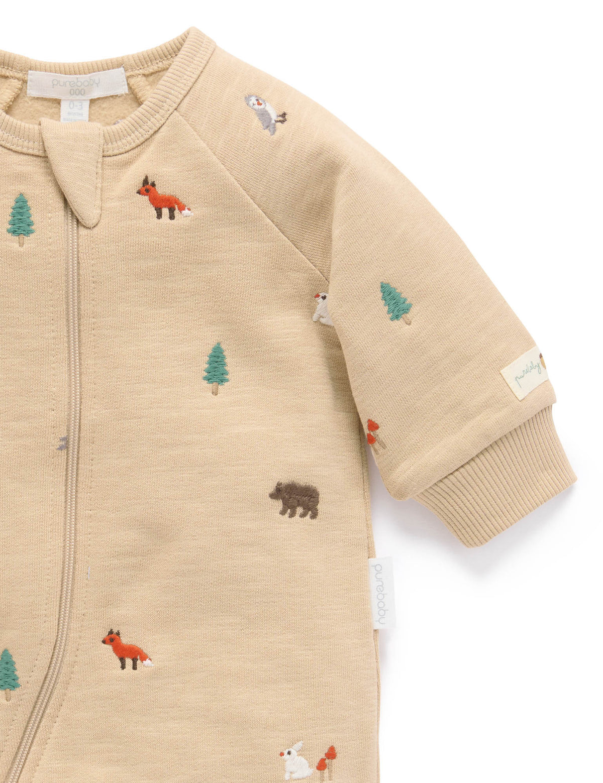 Beige baby onesie with forest animal embroidery on a white background