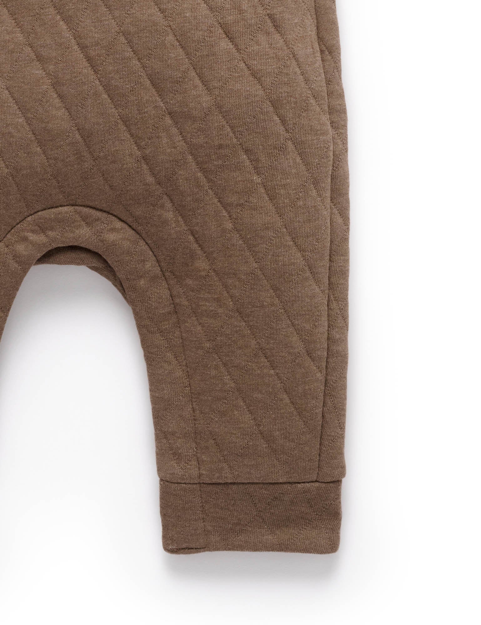Brown quilted baby romper on a white background