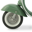 Close-up of a green wheel with a white rim on a white background