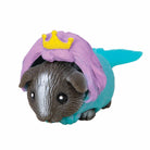 Toy figure of a character with violet hair and a blue shell on a white background
