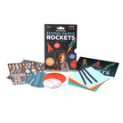 Flying paper rockets kit with book, markers, and colorful paper on a white background
