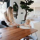 Woman and child at a dining table in a modern living room