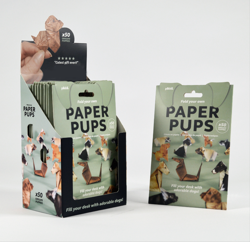 Display of 'Paper Pups' packaging with dog illustrations on a white background