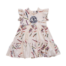 A sleeveless tiered baby dress in cream with a colorful crayon print and a navy blue monogram on the chest, shown against a plain white background.