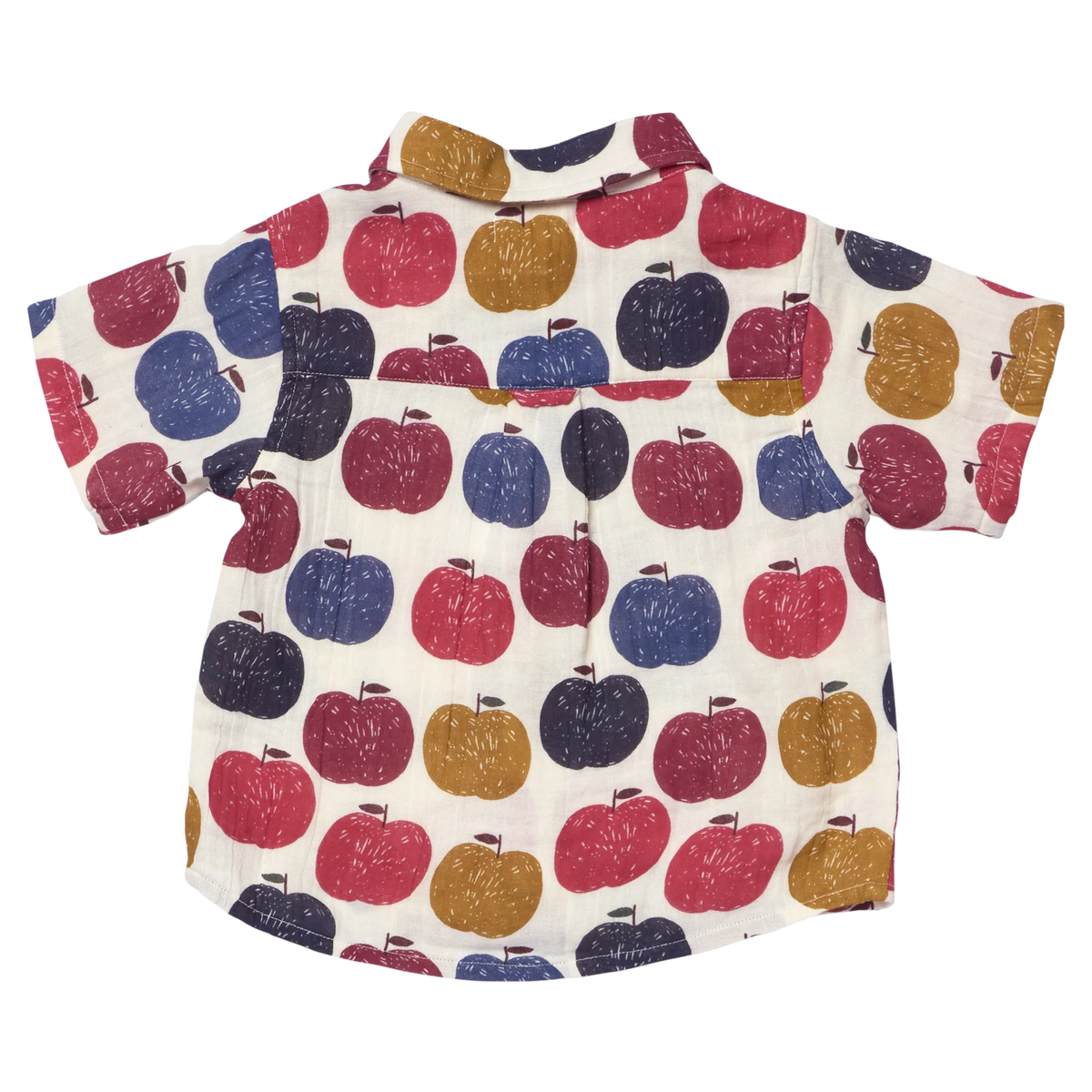 A short-sleeve baby shirt with an all-over pattern of colorful hand-drawn apples in red, blue, and mustard yellow on an off-white background.