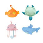 Set of four plush toys shaped like a fish, turtle, jellyfish, and shark on a white background.