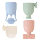 Set of four pastel-colored silicone cup holders on a white background