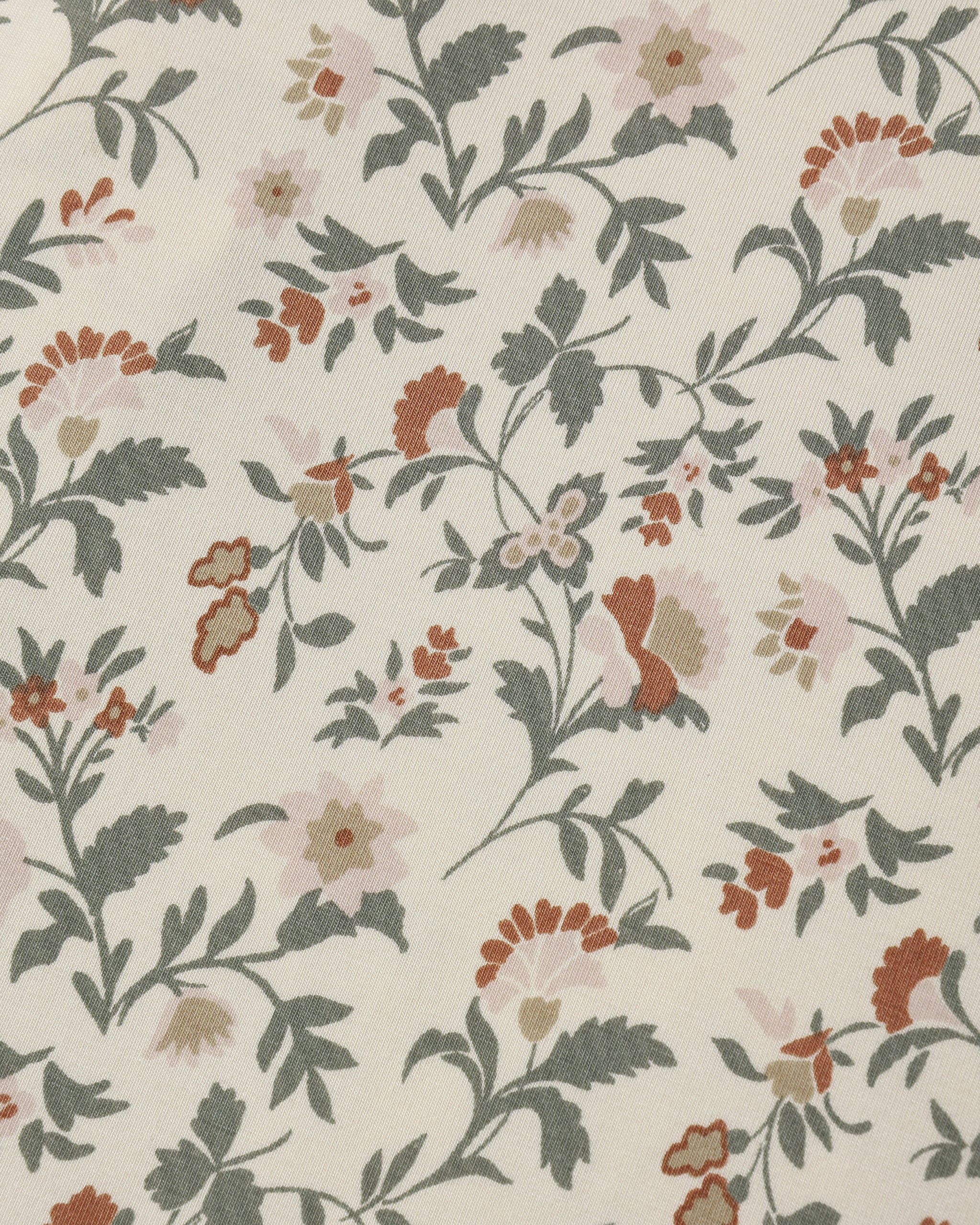 Close-up of the holiday floral fabric pattern by Quincy Mae.