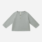 Light green long-sleeve shirt on a white background