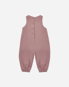 A sleeveless dusty rose baby jumpsuit with a button-up back, photographed flat against a light gray background.
