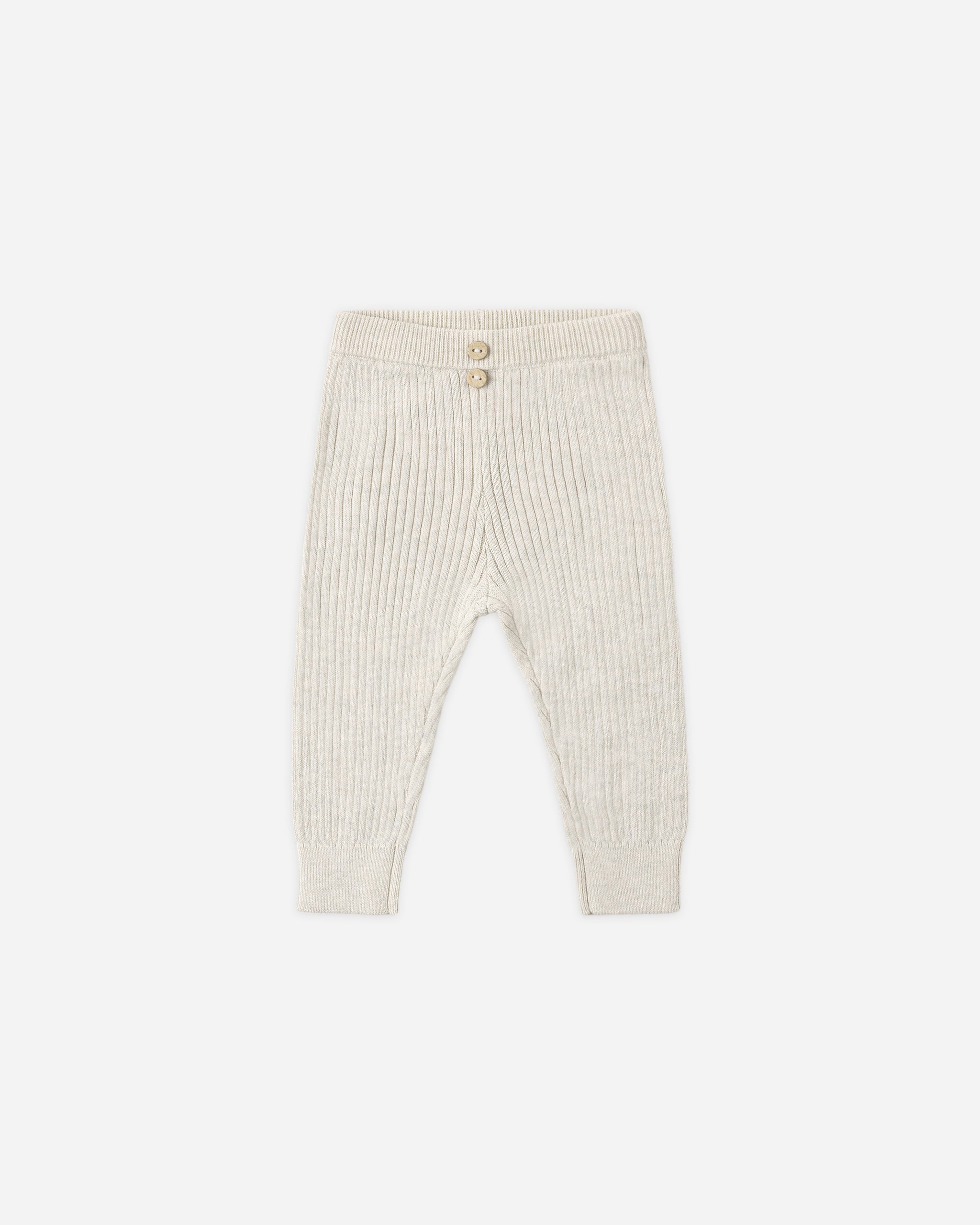 Cream ribbed knit baby pants with a buttoned waistband, shown flat on a light gray background.