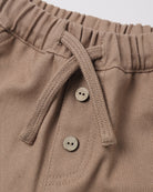 Dusty taupe-brown color with two decorative buttons.