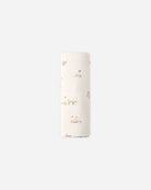 A tall, narrow cylindrical container or roll with a white surface decorated with a delicate, small-scale brown and beige woodland pattern of foxes, rabbits, and plants, set against a solid light gray background.