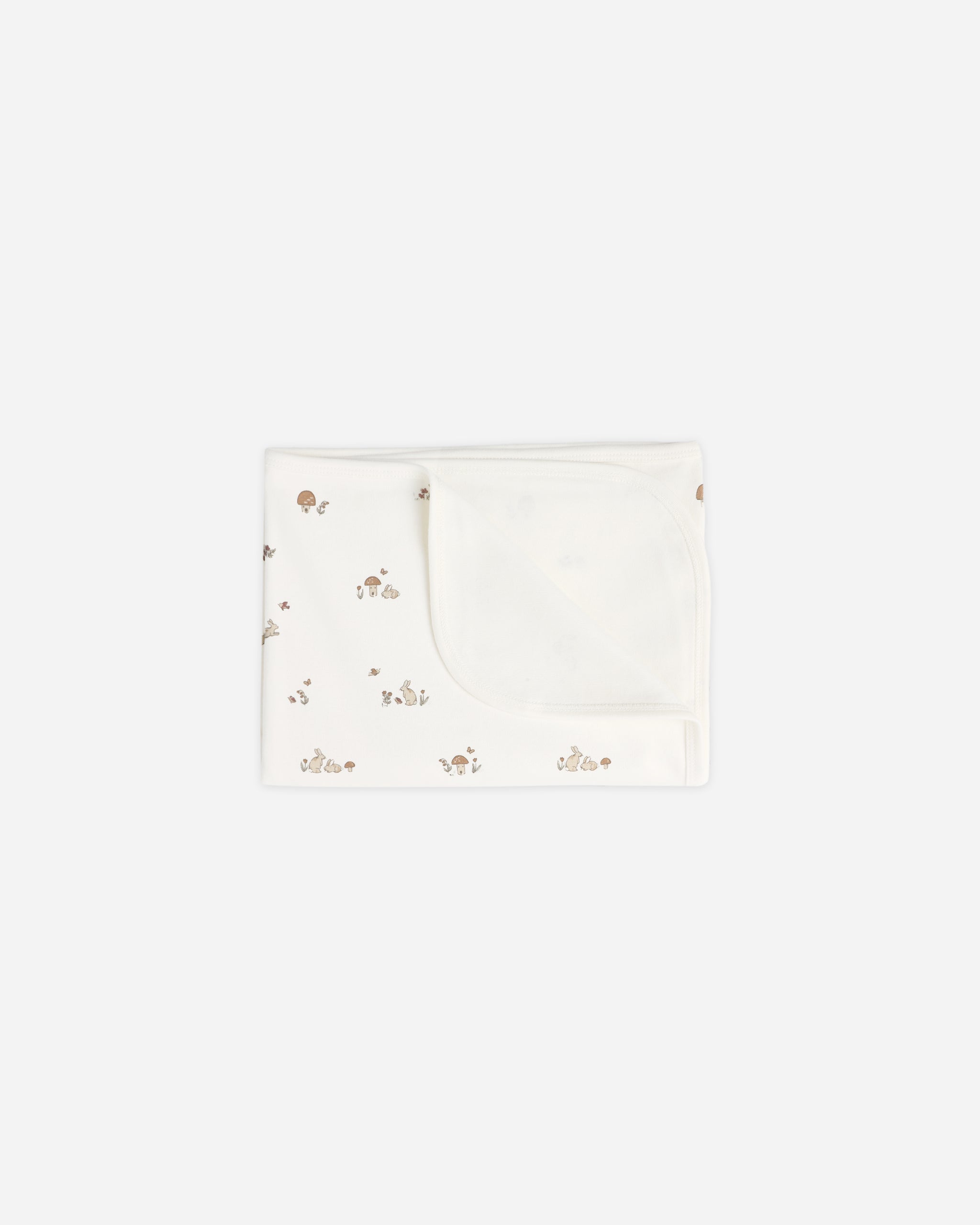 A folded white baby blanket or swaddle with a tiny scattered floral pattern, shown on a plain light gray background.
