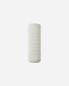 Perfume bottle with geometric label on a white background