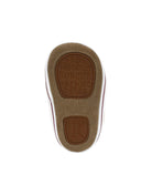 Close-up of a shoe sole with brand name on a white background