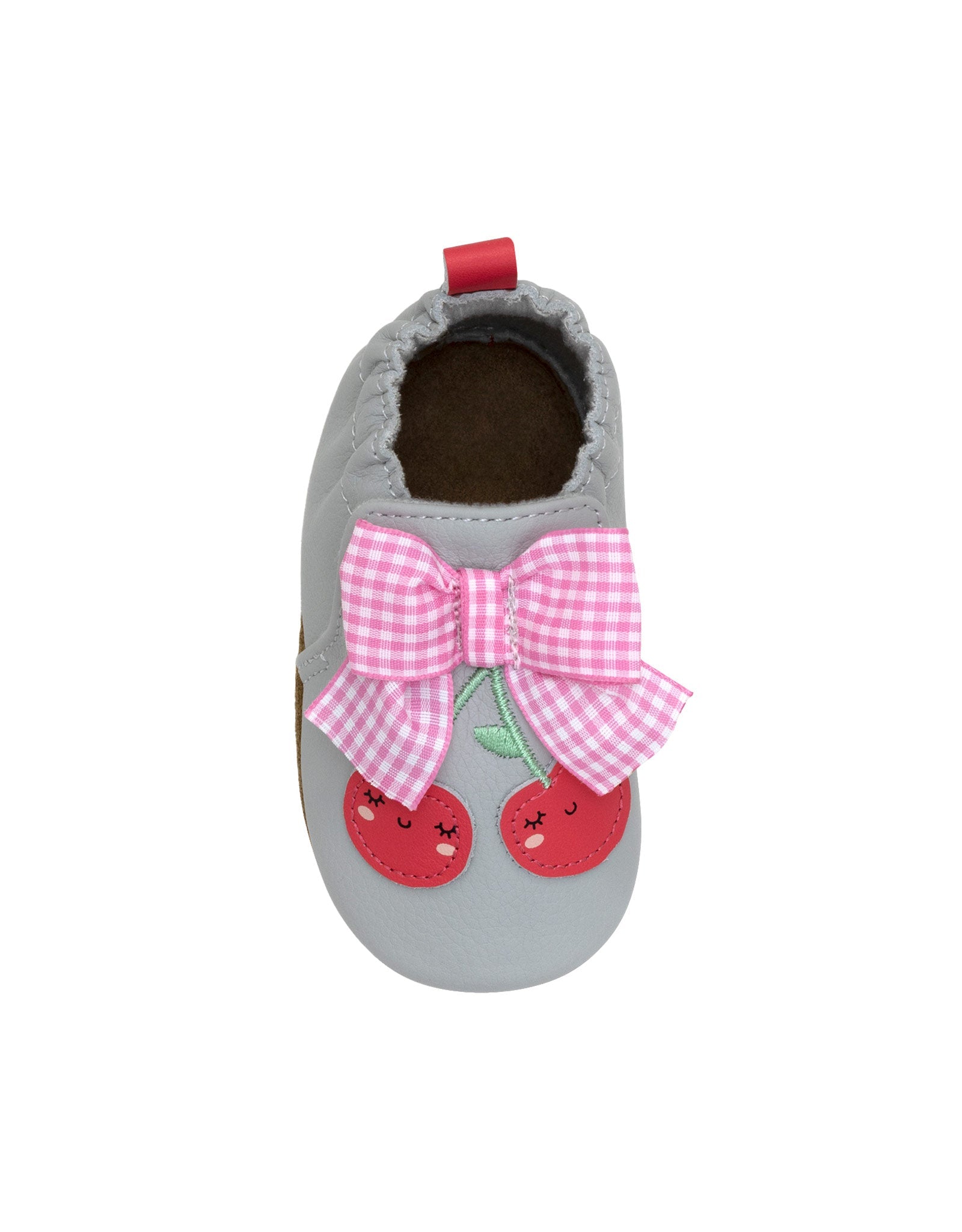 Gray baby shoe with pink bow and cherry design on a white background