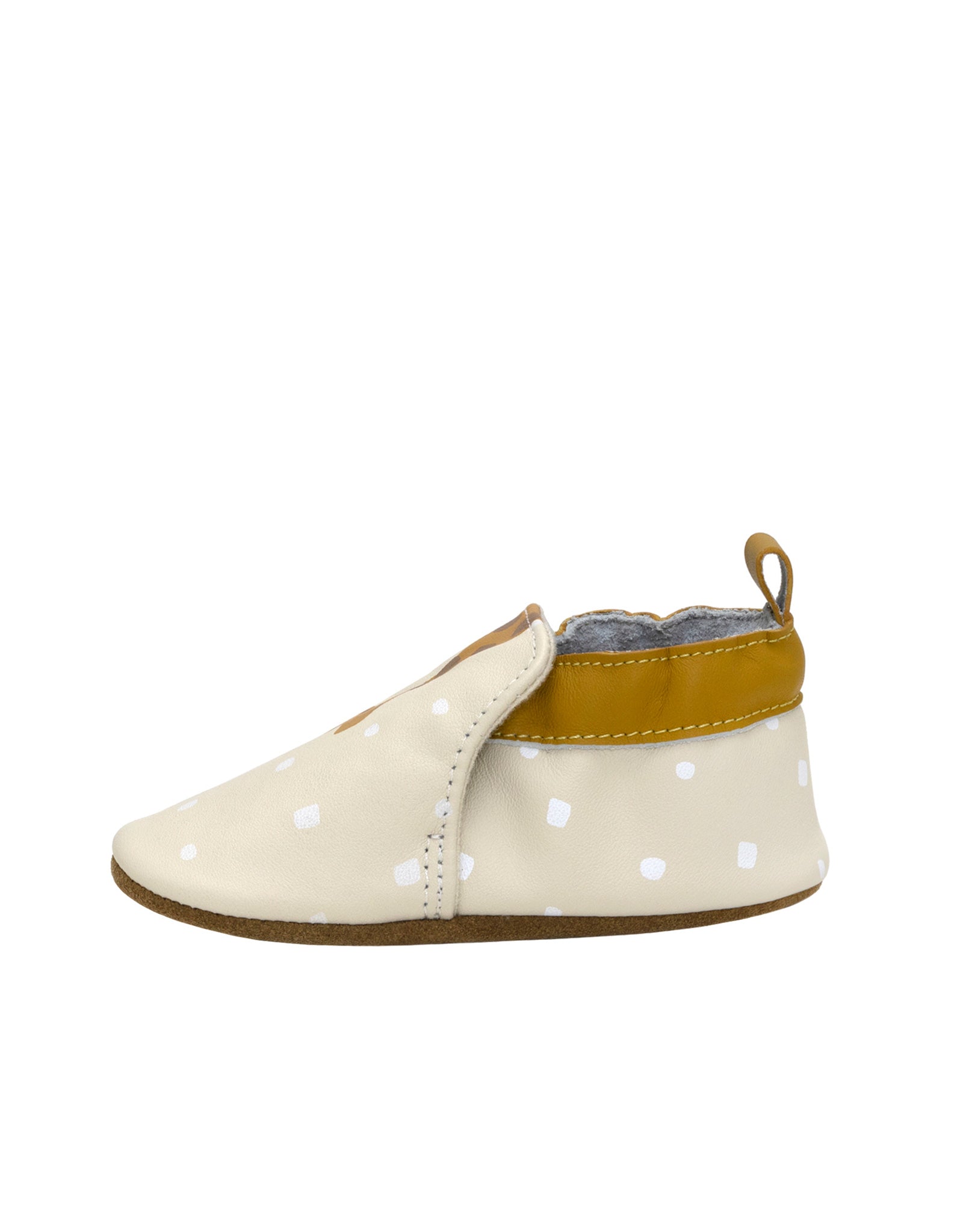 Baby shoe with polka dot pattern on a white background