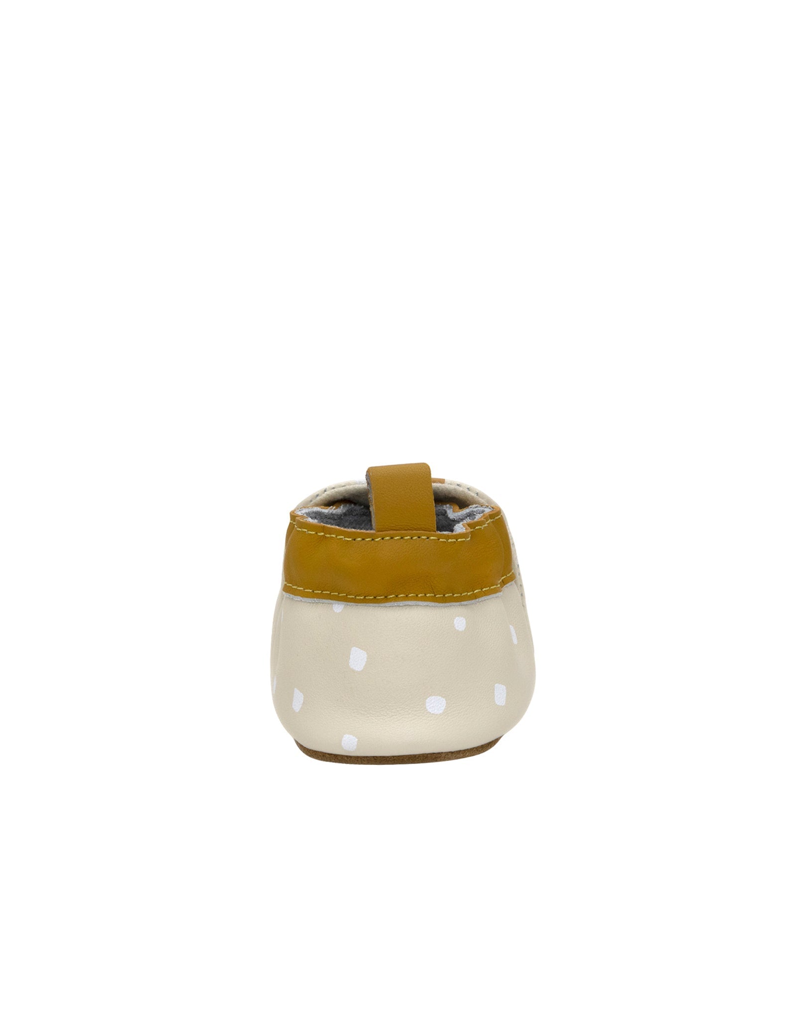 Small cream-colored cup with white polka dots and a mustard yellow rim on a white background