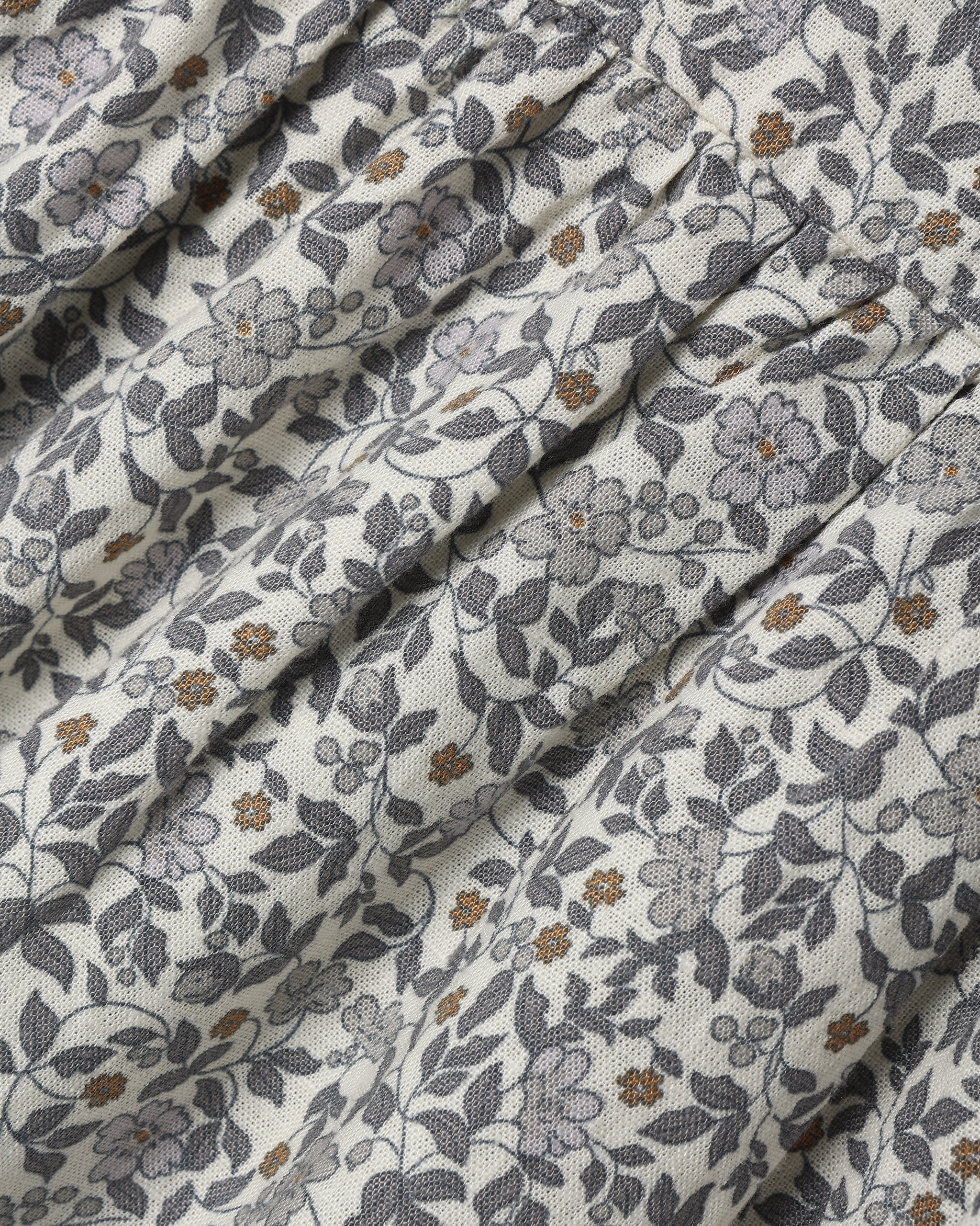 A dense gray and white floral print