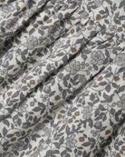 A dense gray and white floral print