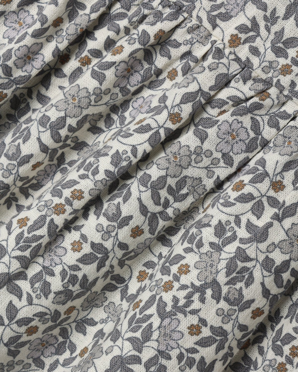 A dense gray and white floral print
