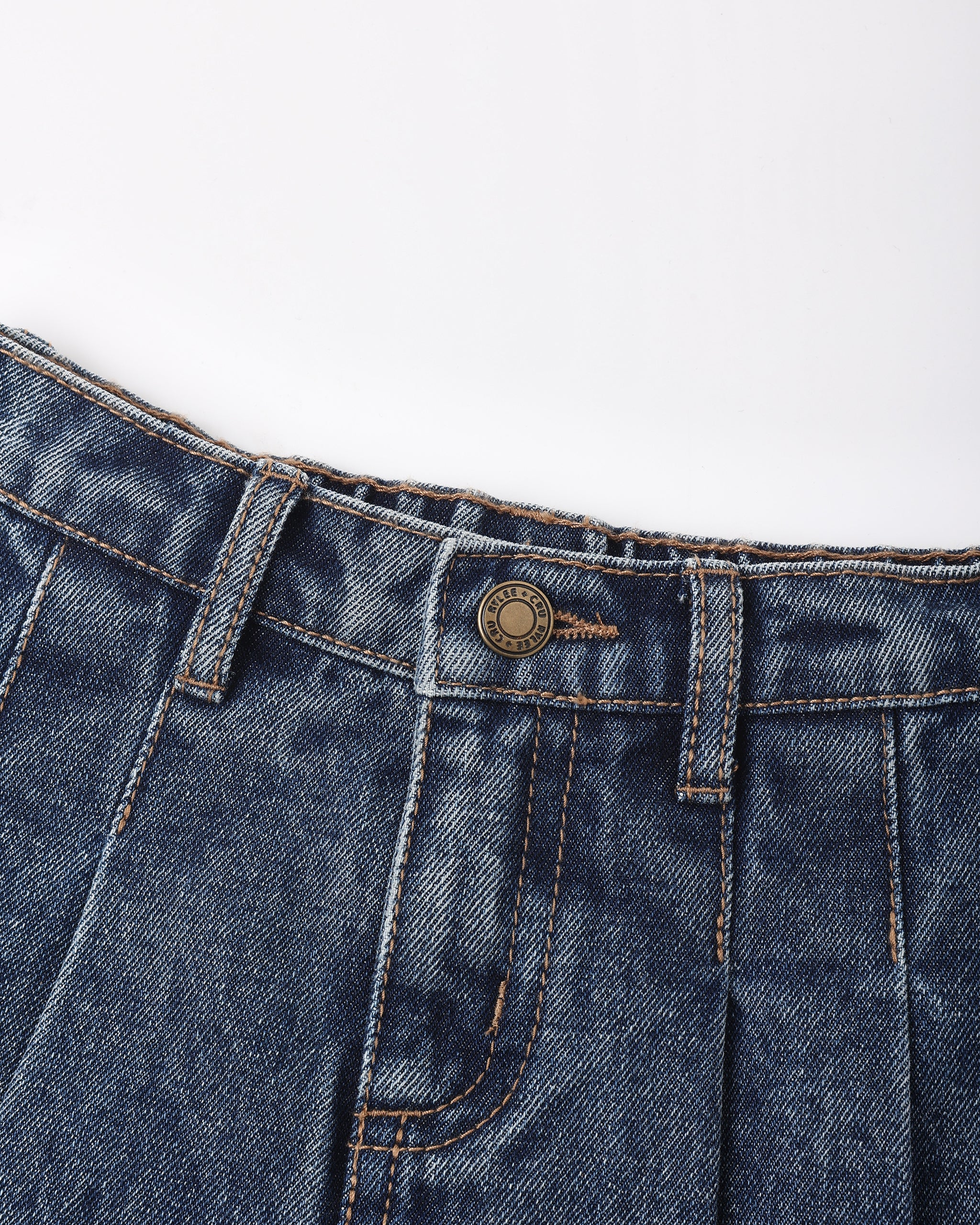 Close-up of dark blue denim jeans showing the waistband, belt loops, button closure, and front pocket stitching on a plain white background.