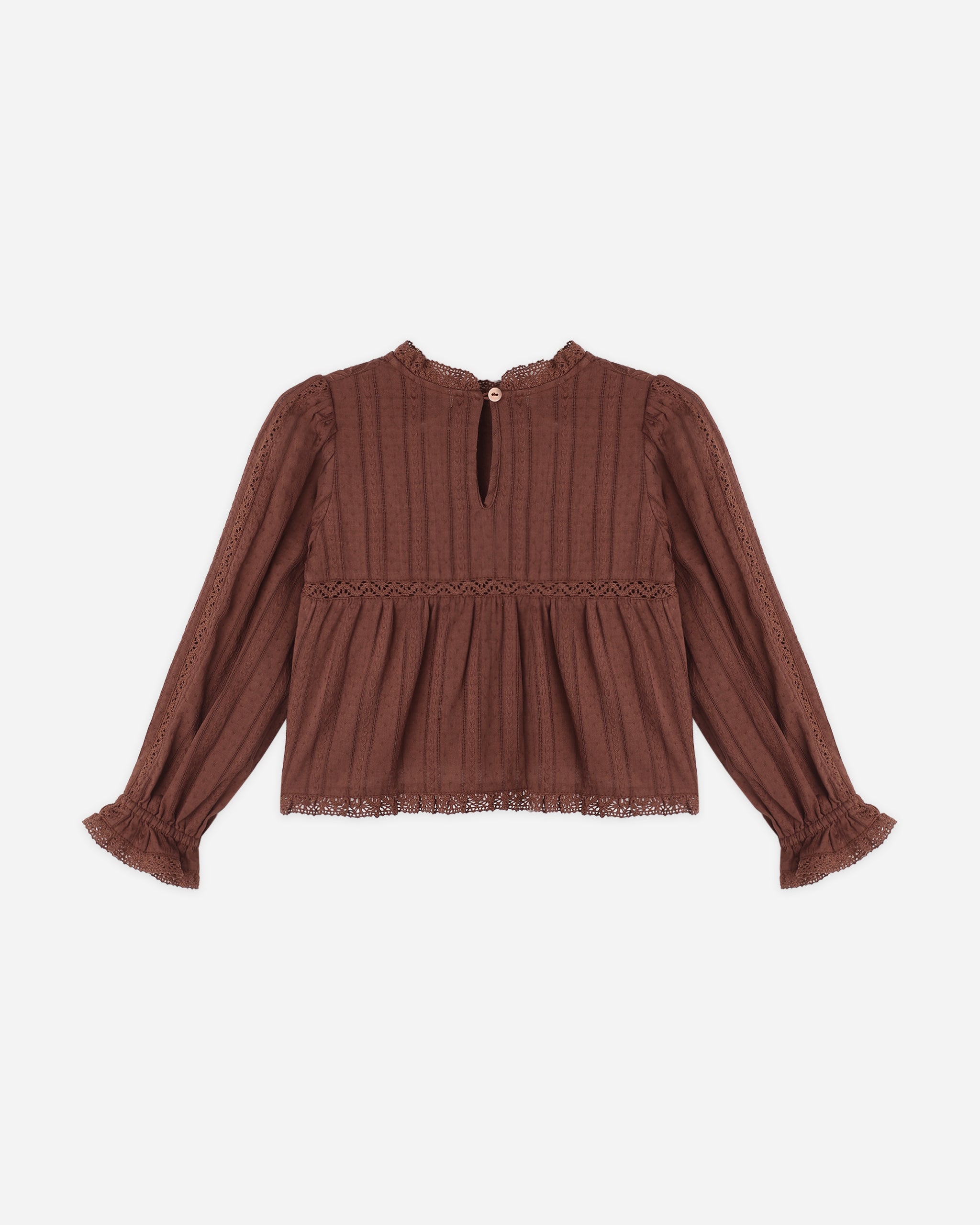 A brown long-sleeve blouse with a textured vertical ribbed knit pattern, a smocked waist, and ruffled cuffs, shown against a plain light gray background.