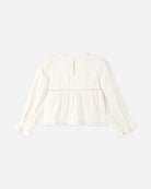 An off-white long-sleeve blouse with a ruffled high neck, vertical pleats, a gathered waist seam, and lace-trimmed cuffs, shown against a plain light gray background.